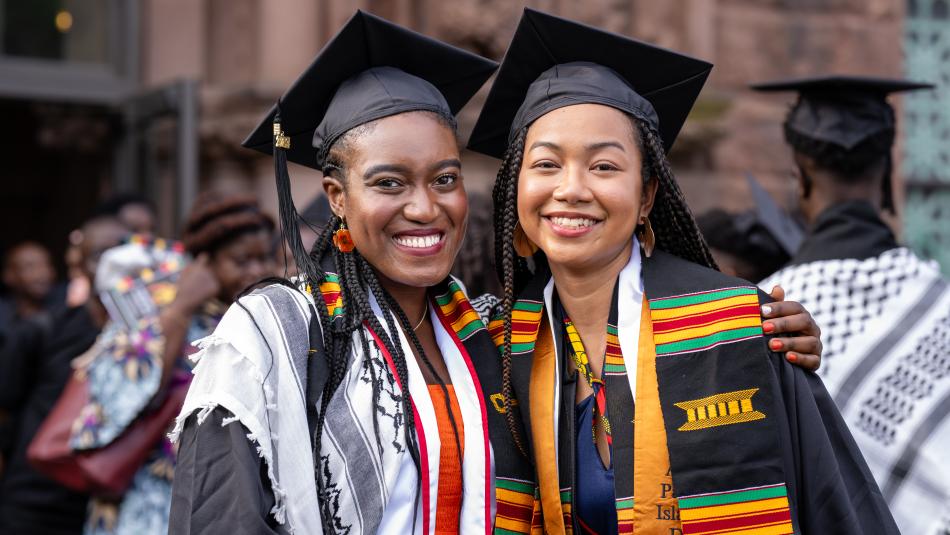 Students smiling at graduation