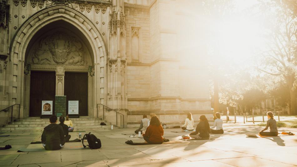 Yoga led by Dean Thames in front of the chapel.