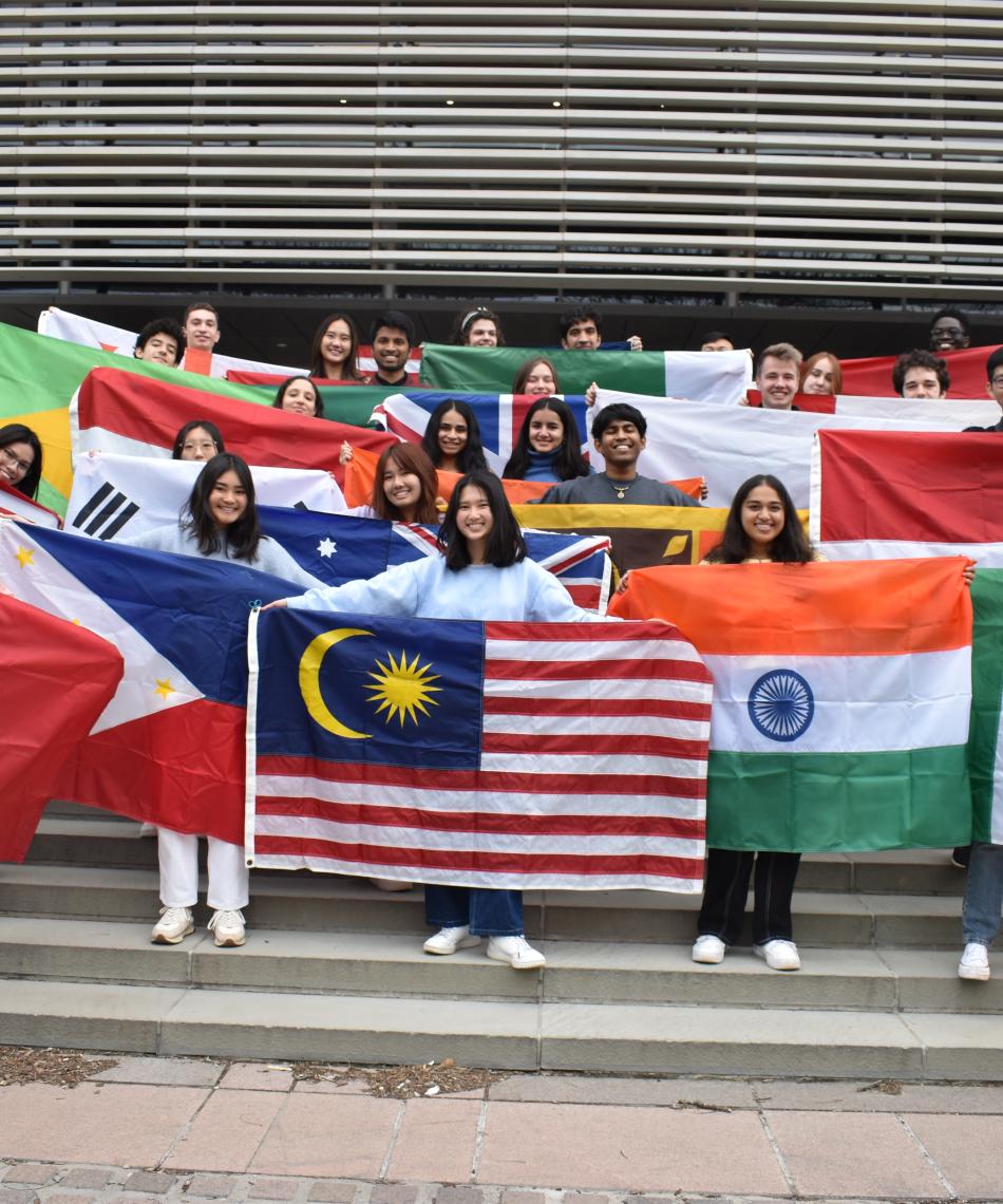 Students holding international flags