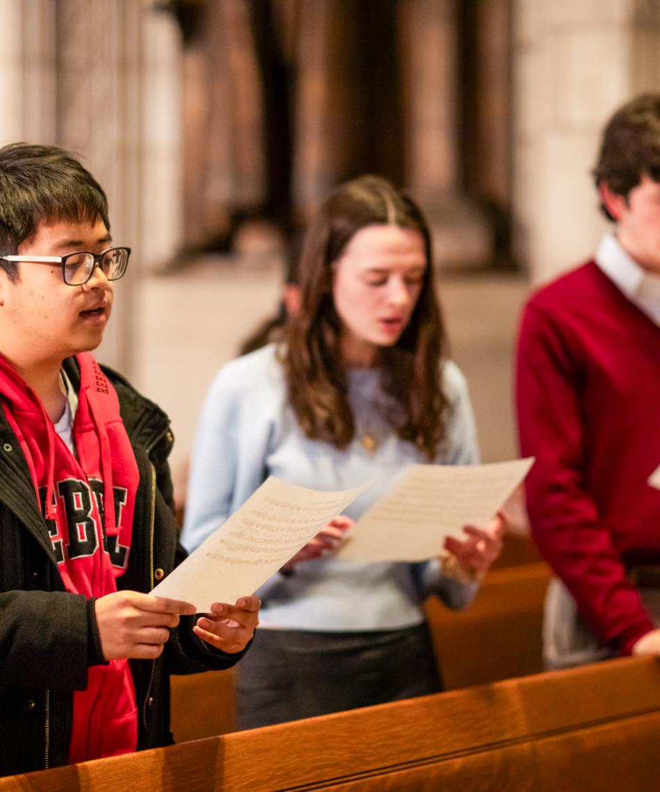 Students singing in the chapel