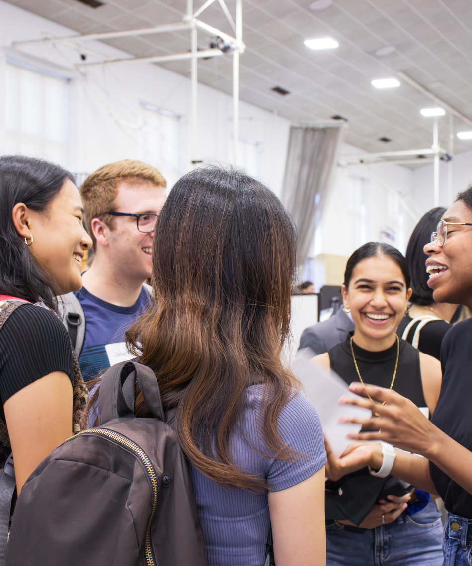 Students chatting at a career fair
