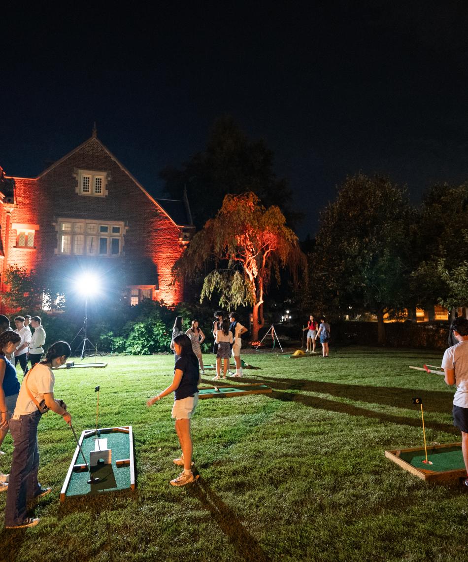 Students playing late night mini-golf in at Campus Club