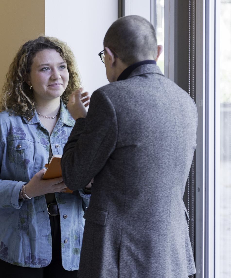 Student Chatting with Guest