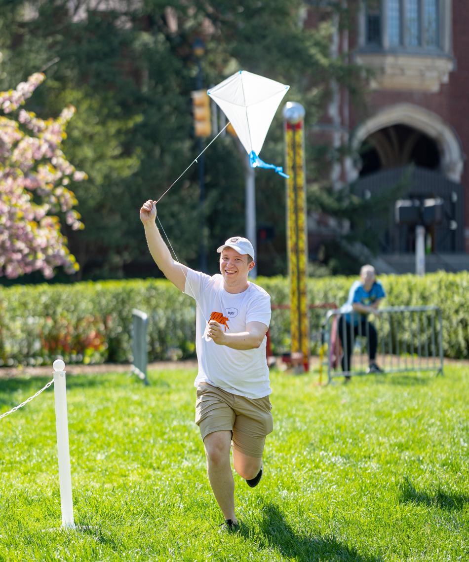 Student holding a kite