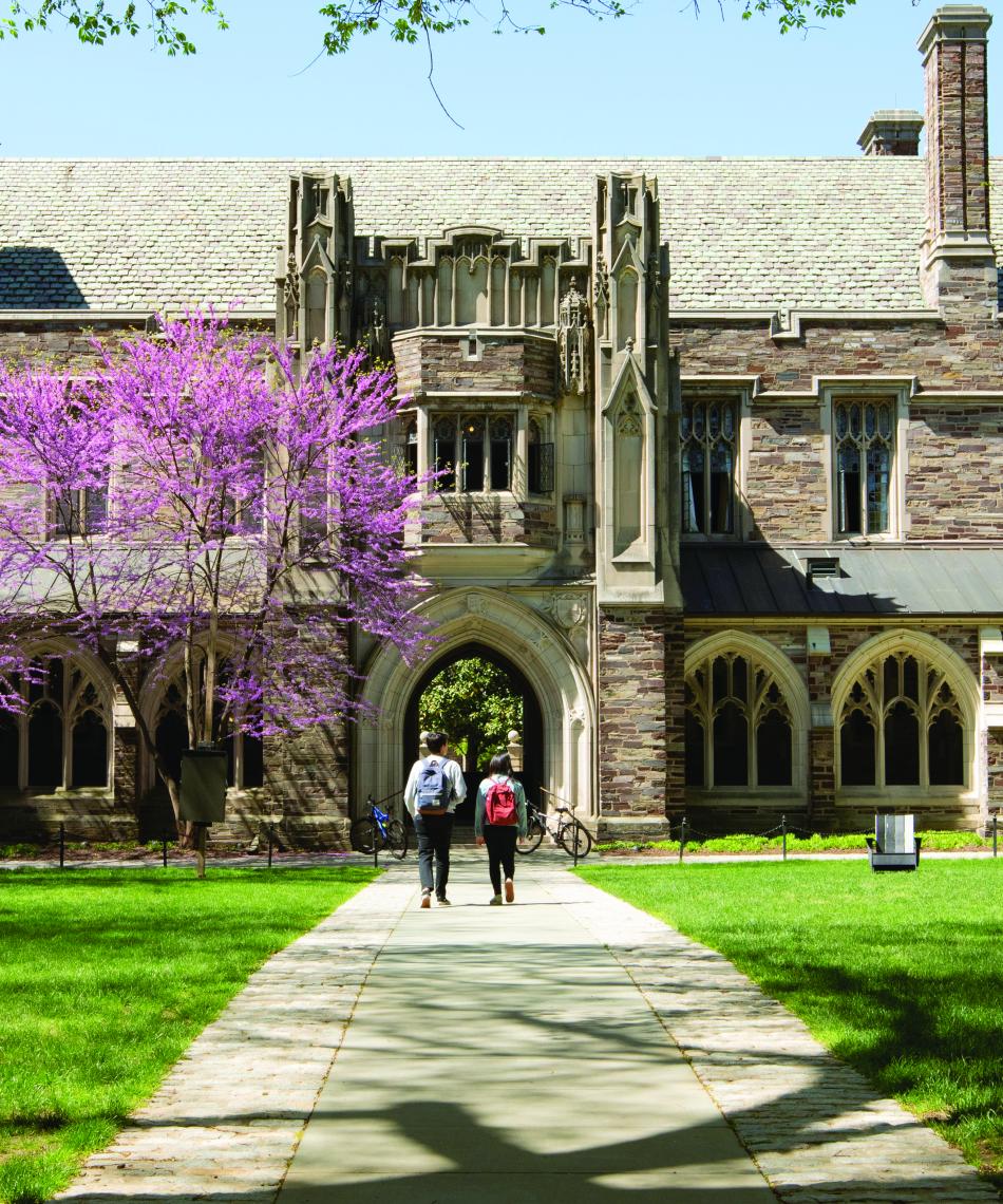 Students walking on campus near Holder Cloister