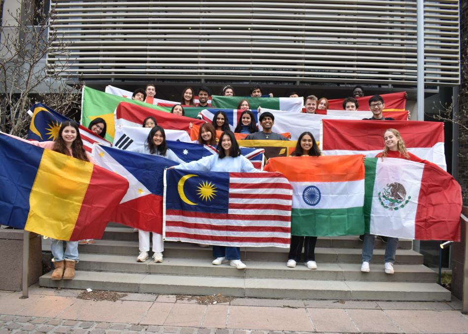 Students holding international flags