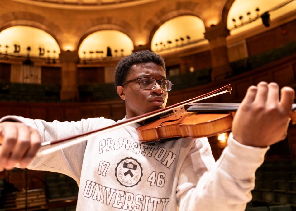 Student playing a violin