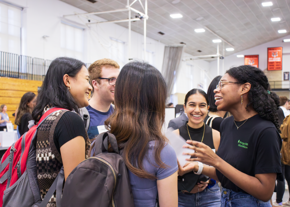 Students chatting at a career fair