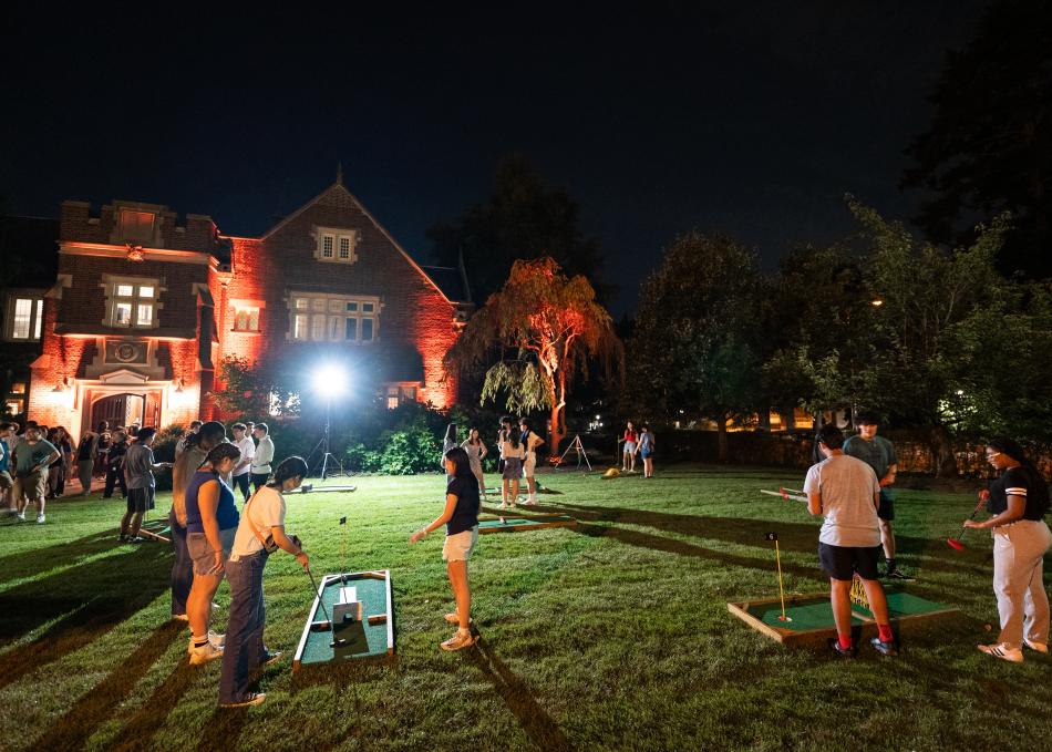 Students playing late night mini-golf in at Campus Club