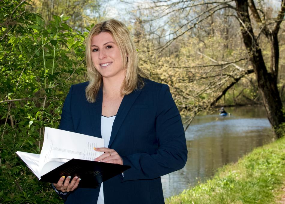 Student holding thesis project
