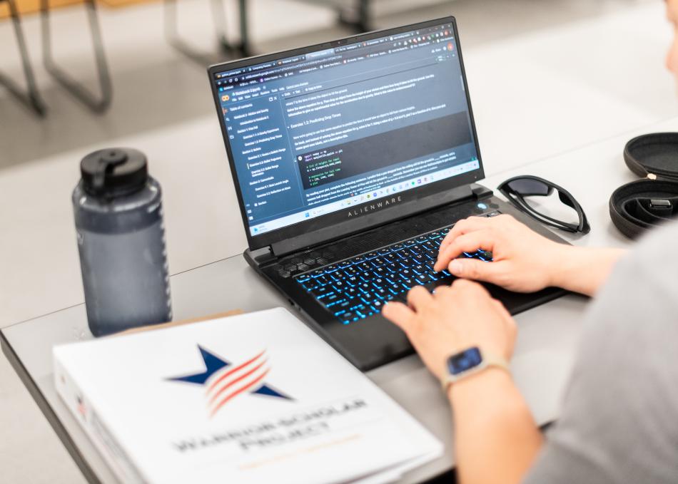 ROTC student on a laptop