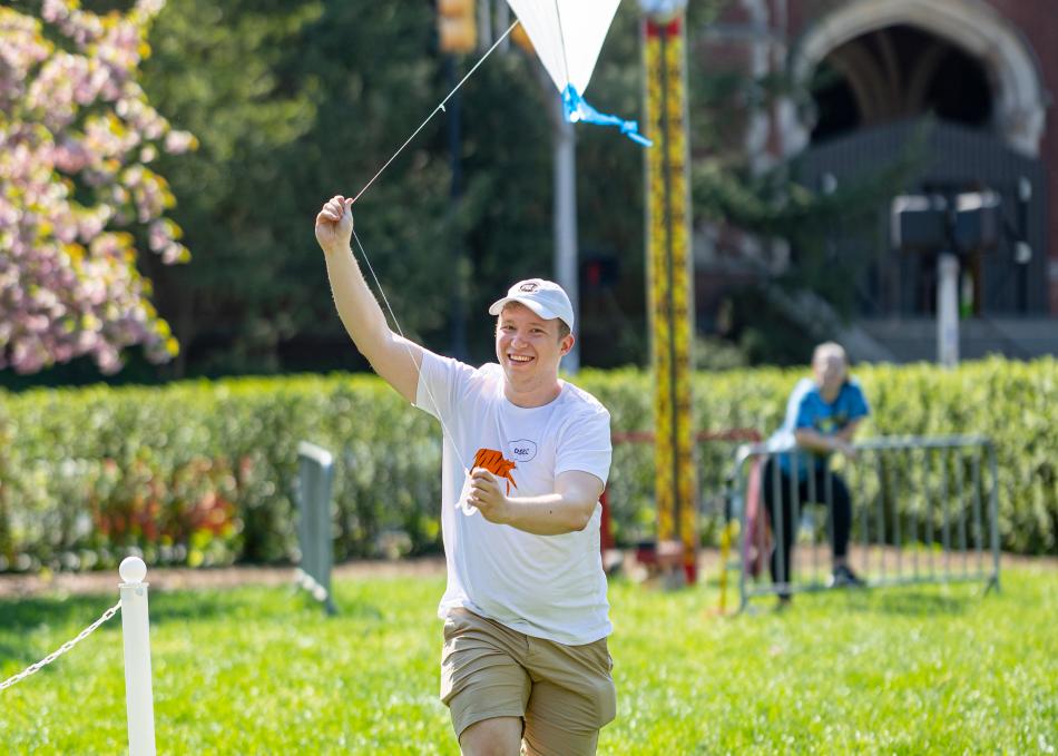 Student holding a kite