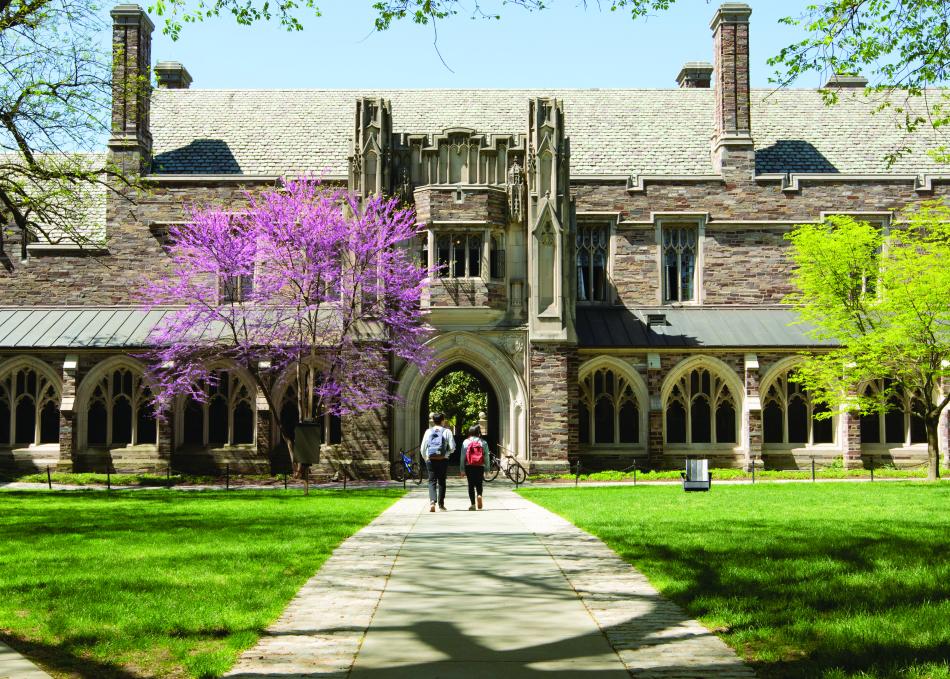 Students walking on campus near Holder Cloister