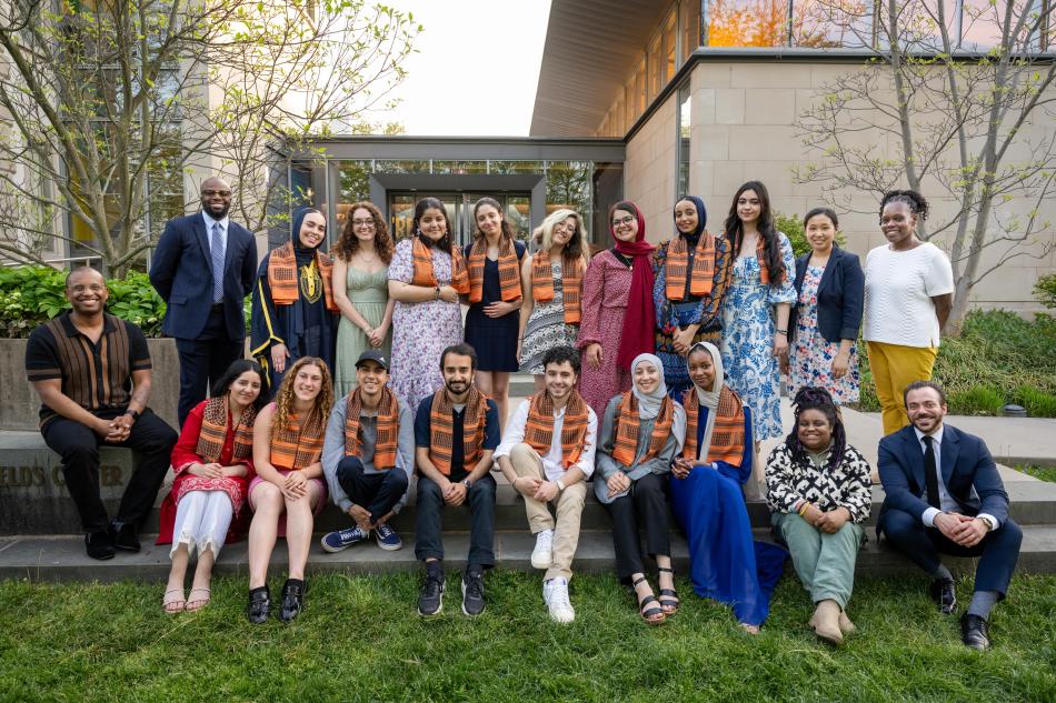 Students posing for a picture during a cultural graduation ceremony